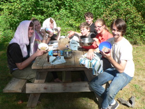 Campers preparing herbal blends for facial cleansing and relaxation.