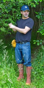 The author instructing a group of herbal class students on identifying and harvesting willow.