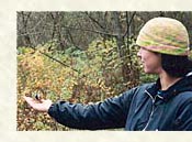 Wolf College Staff with Chickadee In Hand